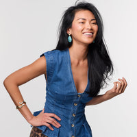 Mignonne Gavigan Natalia drop earrings with intricate design and gold-tone accents, hanging gracefully against a neutral background.