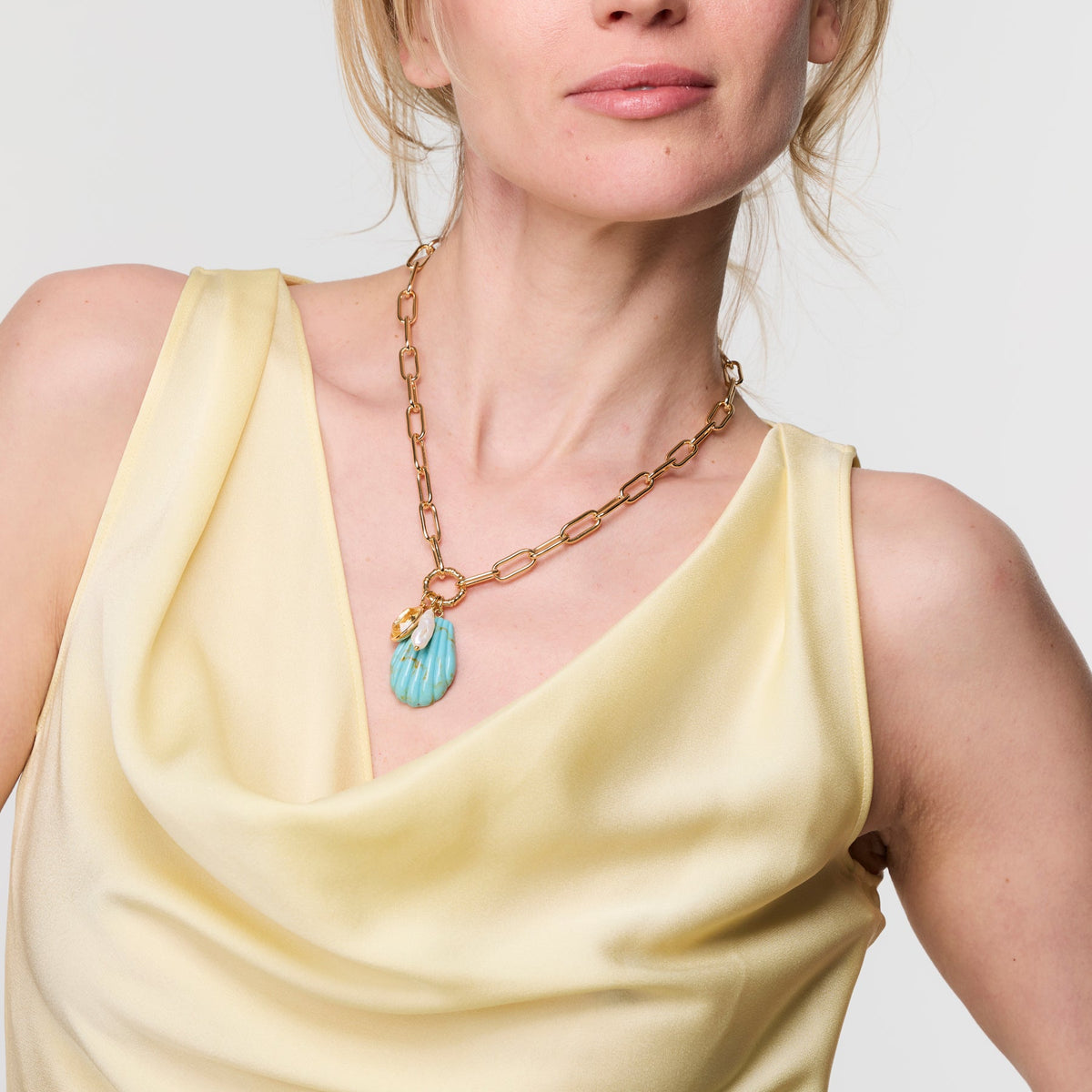 Mignonne Gavigan Natalia Charm Necklace featuring delicate chain and elegant charm pendant on a white background.