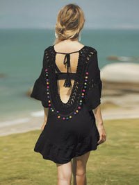 Crochet V-neck beach cover-up dress by Trendsi featuring lightweight crochet fabric and a relaxed V-neck design.