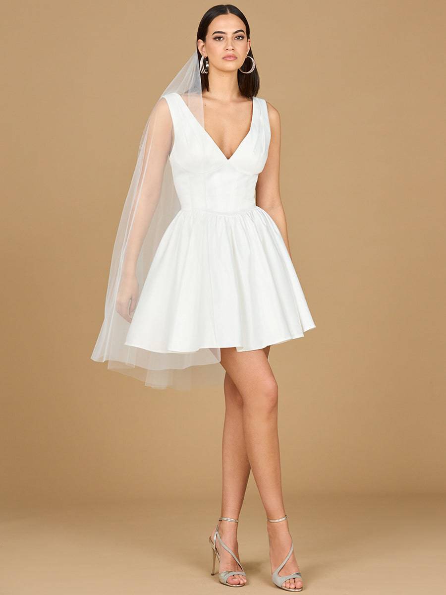 Ivory V-neck A-line bridal short dress by Lara New York with matching veil, showcased on a model.