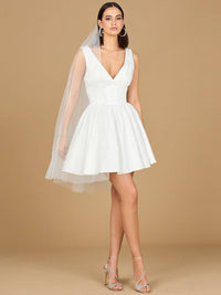 Ivory V-neck A-line bridal short dress by Lara New York with matching veil, showcased on a model.