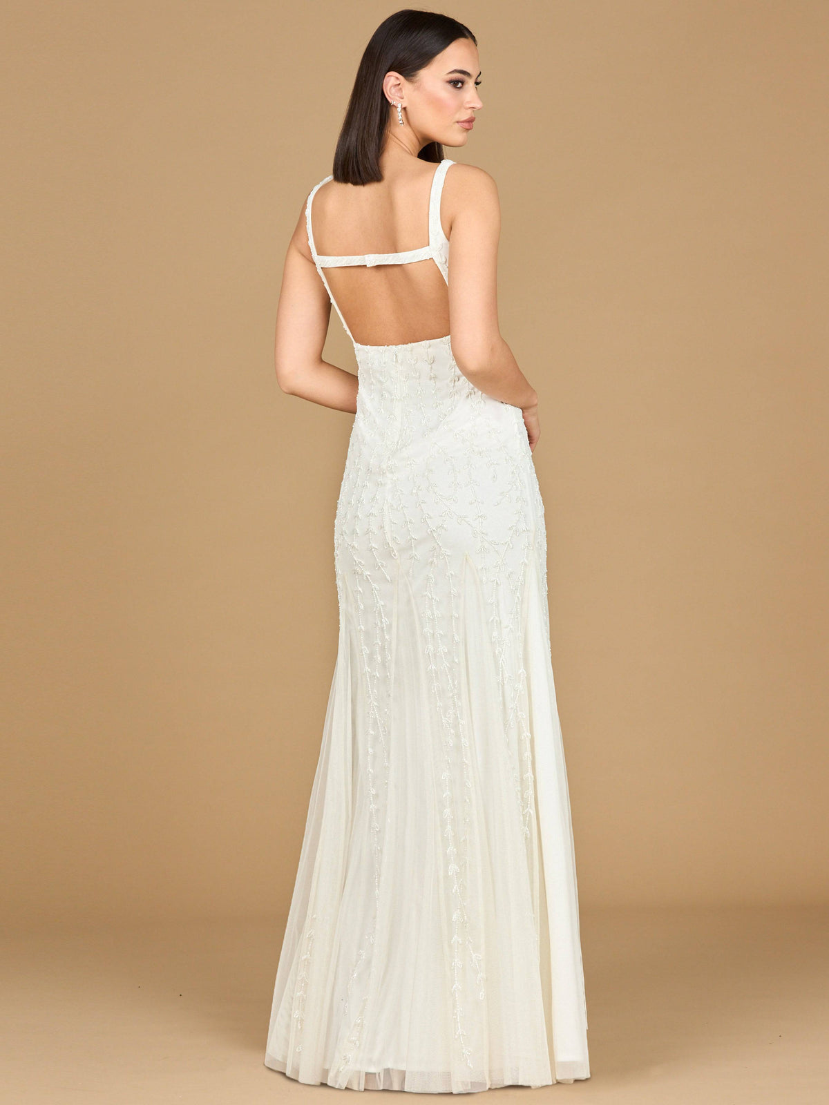 Ivory beaded bridal gown with godets by Lara New York, elegant wedding dress featuring intricate beadwork and flowing design.