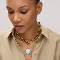 Mignonne Gavigan Odyssey necklace featuring a blue etched globe and reversible compass charm on a gold chain.