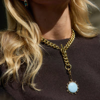Mignonne Gavigan Odyssey necklace with blue etched globe and reversible compass charm on gold chain.