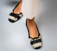 Handmade Menina Step Brive Raffia bag with woven texture, natural tones, and shoulder strap, crafted in Spain.