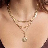 Gold Seeker Necklace by Mignonne Gavigan featuring a compass pendant with multi-crystals on a chain.