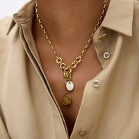 Mignonne Gavigan Voyager gold necklace with a mother-of-pearl charm pendant, elegant jewelry for sophisticated style.