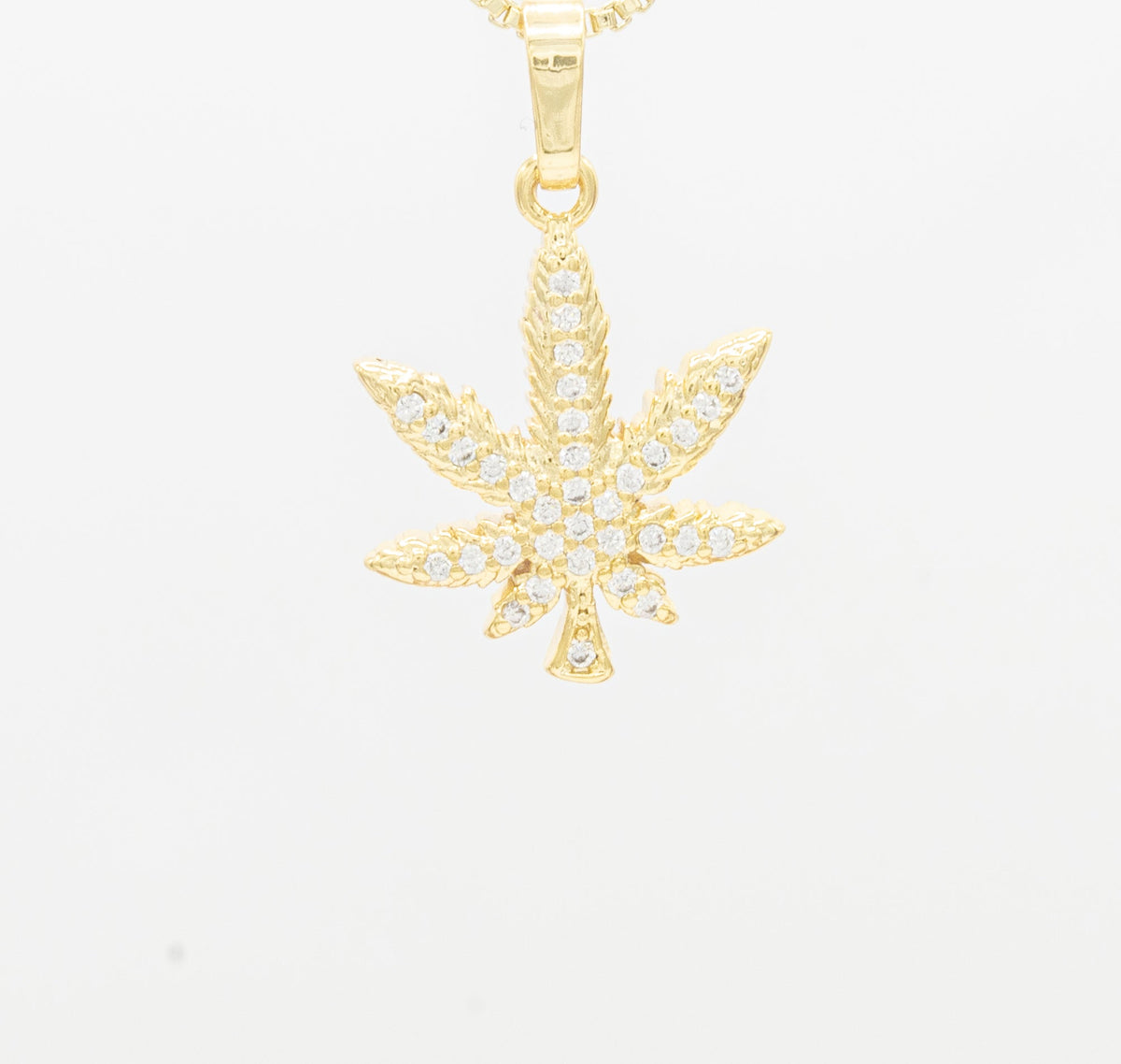 Gold-filled pendant featuring a cannabis leaf design with cubic zirconia accents, crafted by JB Jewelry BLVD.