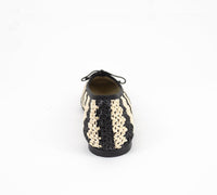 Handmade Lucy Raffia bag by Menina Step featuring woven raffia material and natural earthy tones, made in Spain.