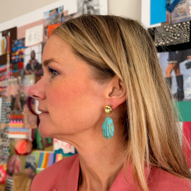 Mignonne Gavigan Natalia drop earrings featuring elegant charm design worn by a model, showcasing stylish jewelry accessory.