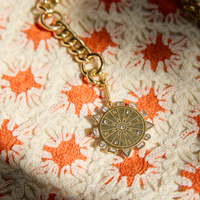 Mignonne Gavigan Odyssey Necklace in blue and gold, featuring a delicate chain and elegant pendant design.