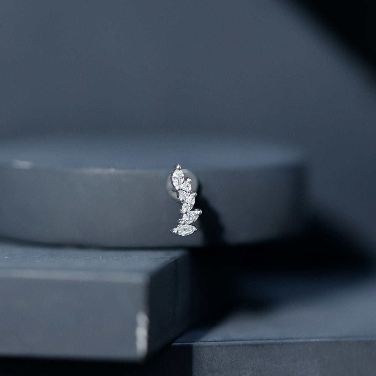 Marquise diamond crawler earring by Rosec Jewels for helix piercing, showcasing elegant diamond-studded body jewelry with a delicate design.