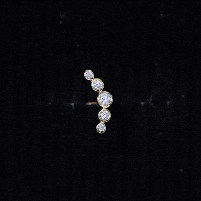 Graduated diamond ear climber earring in bezel setting, yellow gold body jewelry from Rosec Jewels, showcasing elegant design.