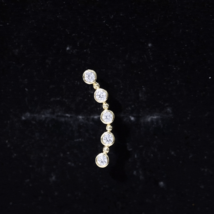 Yellow bezel set diamond crawler earring for cartilage piercing, body jewelry by Rosec Jewels featuring sparkling diamonds and gold accents.