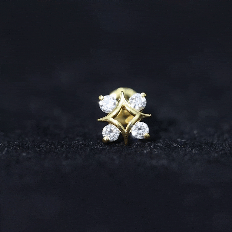 Round cut diamond star helix earring from Rosec Jewels, silver body jewelry with sparkling star-shaped design.
