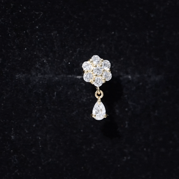 Yellow diamond flower cartilage earring by Rosec Jewels, elegant body jewelry with a delicate floral design for cartilage piercing.