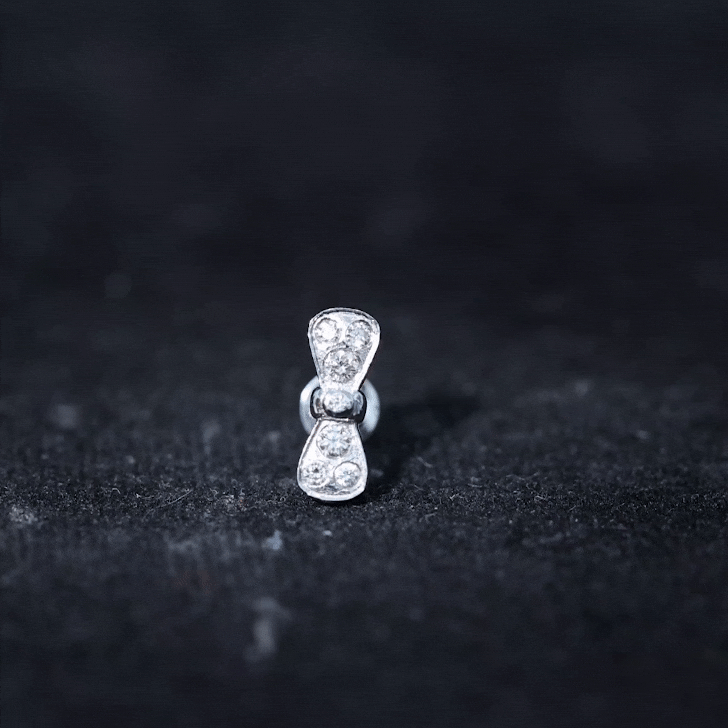 Yellow diamond bow cartilage piercing earring from Rosec Jewels, delicate body jewelry with sparkling gemstone detail.