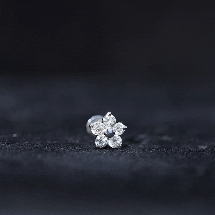 Yellow diamond flower tragus earring from Rosec Jewels, body jewelry with nature-inspired floral design and sparkling gemstone.