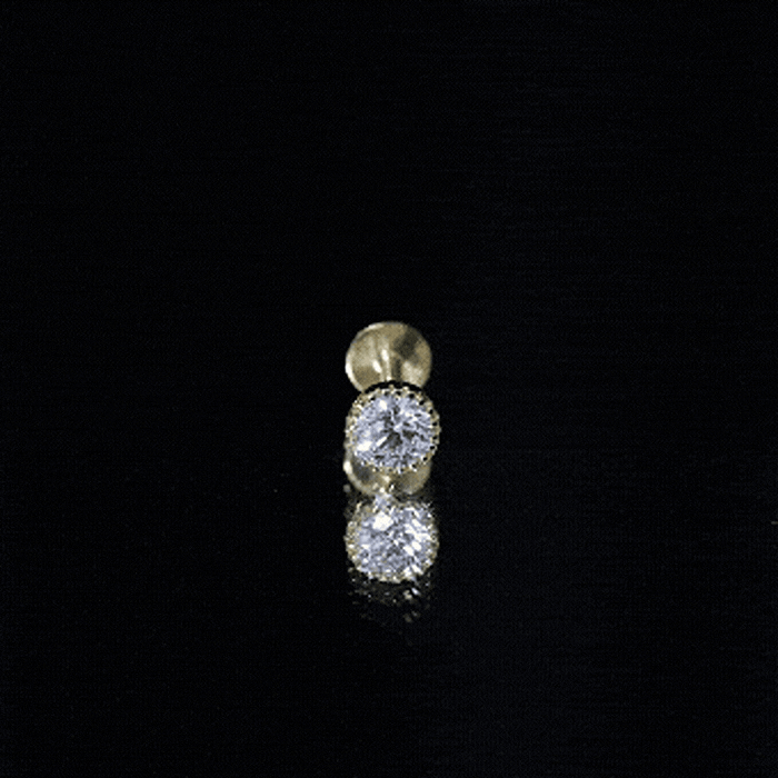 Yellow bezel set diamond solitaire helix piercing earring by Rosec Jewels, showcasing a sparkling diamond in a sleek gold setting.