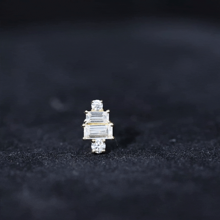 Yellow gold double baguette diamond cartilage piercing earring from Rosec Jewels, showcasing sparkling gemstones and sleek body jewelry design.