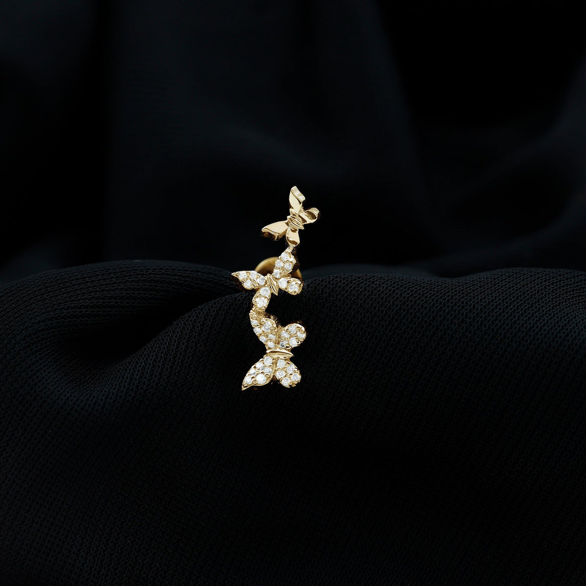Moissanite butterfly climber earring for helix piercing, rose gold body jewelry with sparkling gemstone accents.