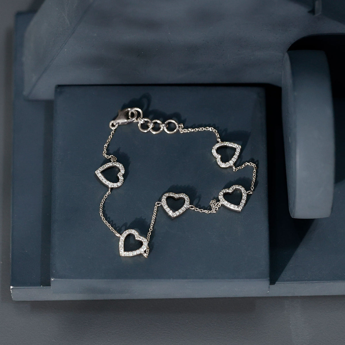 Rosec Jewels diamond heart chain bracelet in prong setting, featuring sparkling diamonds on a delicate silver chain.