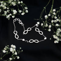 Rosec Jewels cubic zirconia infinity station chain bracelet with sparkling zirconia accents and delicate link design.