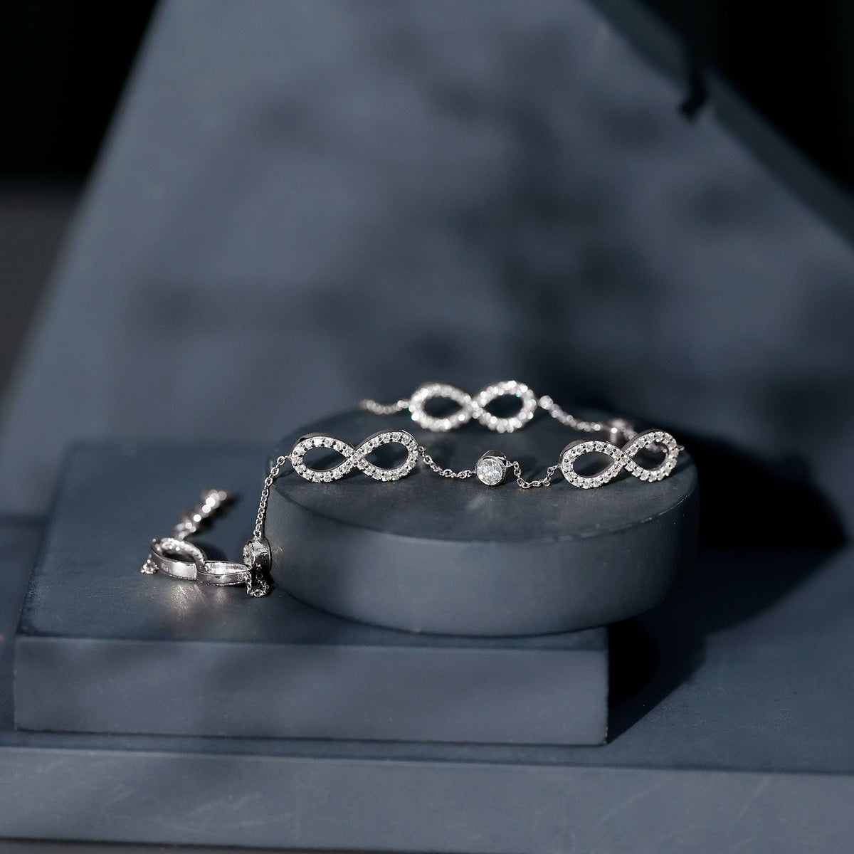 Rosec Jewels cubic zirconia infinity station chain bracelet with sparkling zirconia stones and delicate link design.