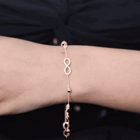 Yellow gold Moissanite infinity chain bracelet by Rosec Jewels featuring sparkling Moissanite stones and delicate infinity design.