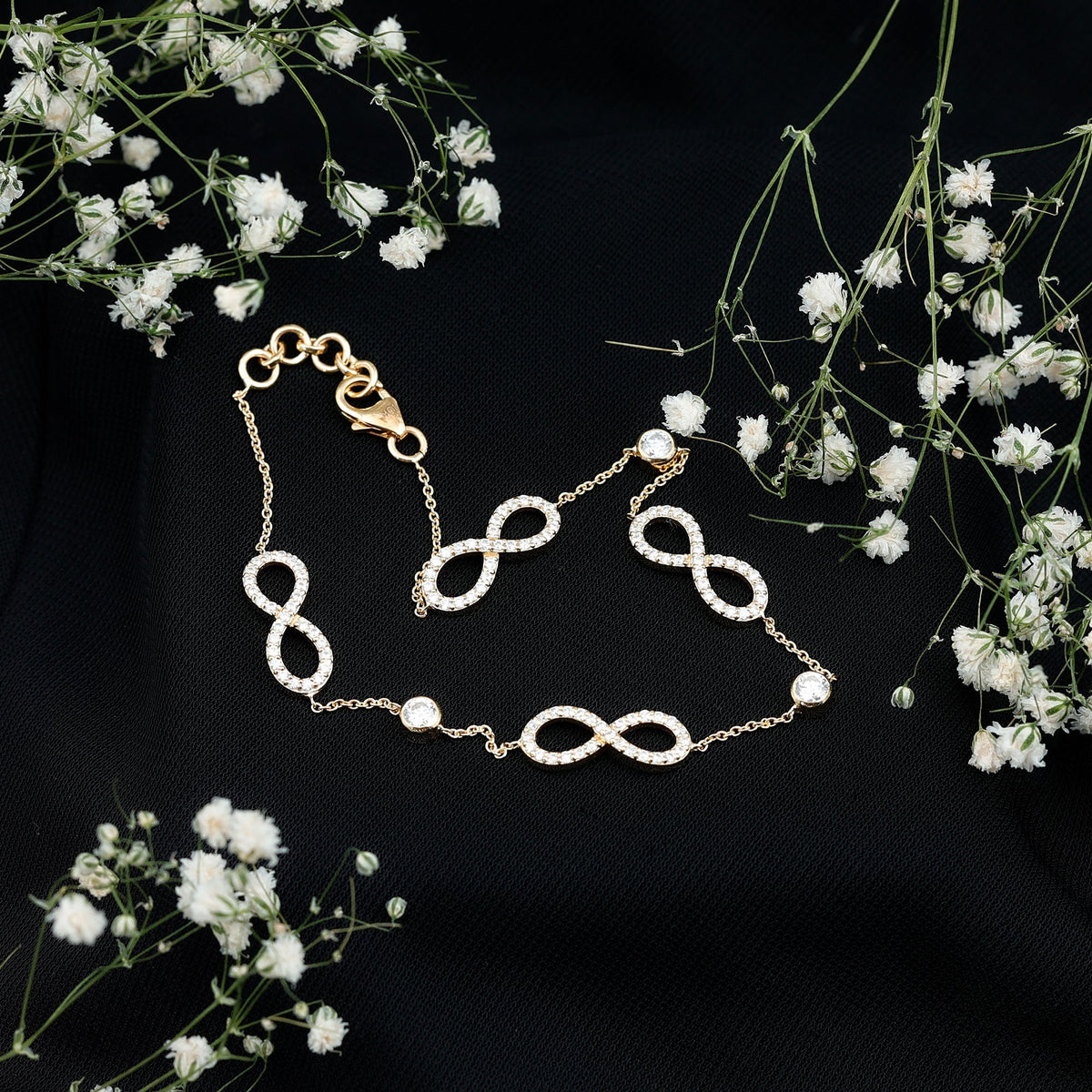 Rosec Jewels Certified Moissanite infinity chain bracelet with sparkling moissanite stones and silver-tone metal links.