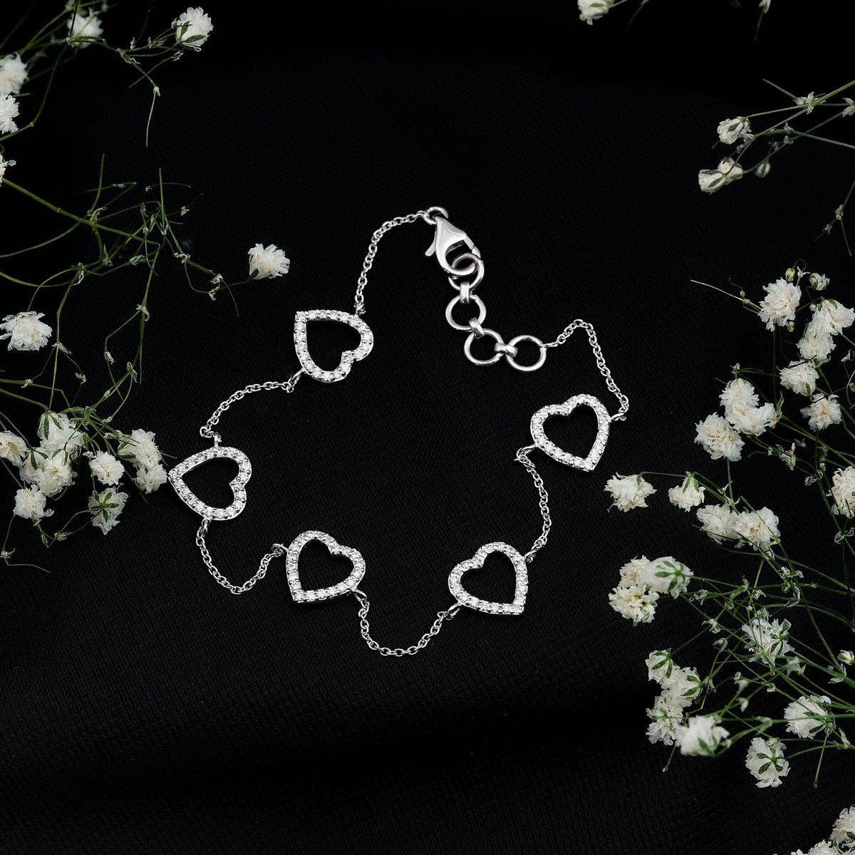 Rosec Jewels certified diamond heart chain bracelet in prong setting, featuring sparkling diamonds on a delicate gold bracelet.