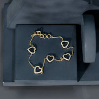 Rosec Jewels diamond heart chain bracelet in prong setting, featuring sparkling certified diamonds on a delicate gold chain.