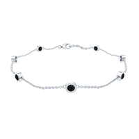 Bezel set black onyx seven-stone station chain bracelet by Rosec Jewels featuring alternating oval gemstones.