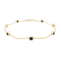 Bezel set black onyx seven-stone station chain bracelet by Rosec Jewels featuring polished black onyx stones on a silver chain.