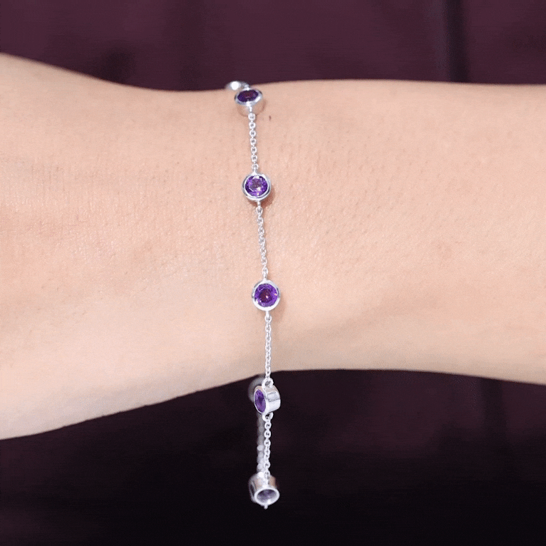 Bezel set amethyst station chain bracelet for women by Rosec Jewels, featuring purple gemstones on a delicate gold chain.