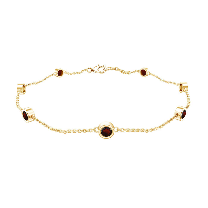Bezel set garnet seven-stone station chain bracelet by Rosec Jewels, featuring polished metal links and vibrant red gemstones.
