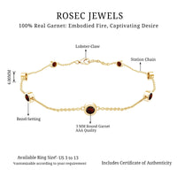 Bezel set garnet seven-stone station chain bracelet by Rosec Jewels featuring red garnet gemstones on a delicate gold chain.