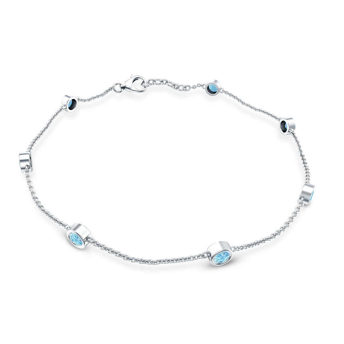 Bezel set aquamarine station bracelet for women by Rosec Jewels, featuring blue gemstones on a delicate metal chain.