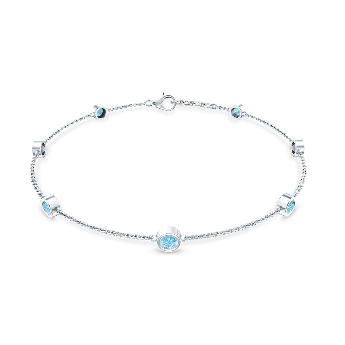 Bezel set aquamarine station bracelet for women by Rosec Jewels, featuring blue gemstone beads on a delicate silver chain.