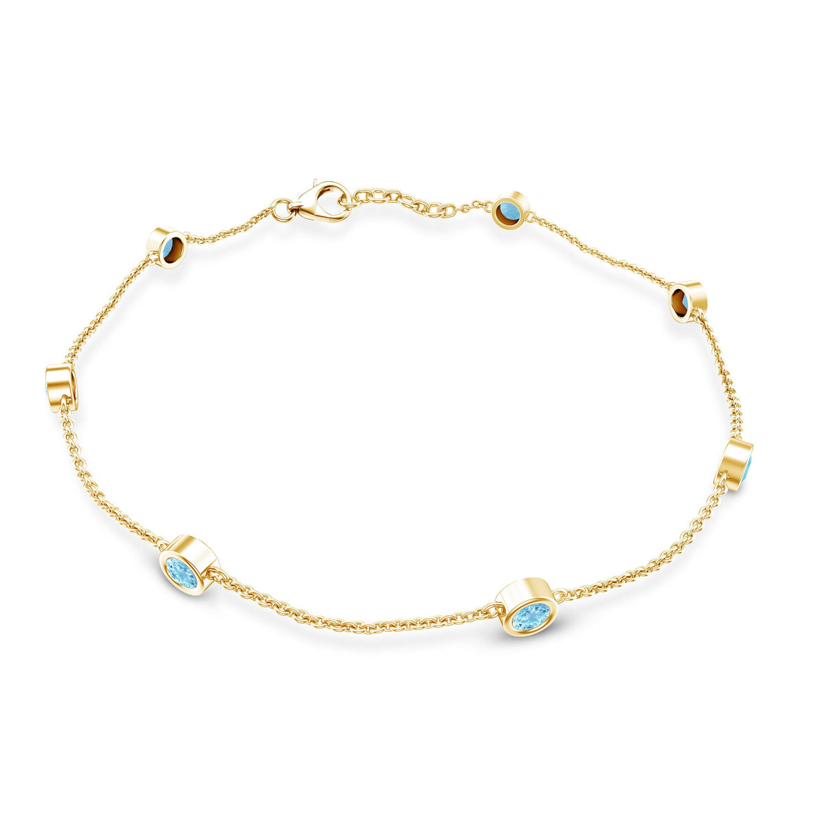 Bezel set aquamarine station bracelet for women by Rosec Jewels with alternating aquamarine gemstones on a delicate metal chain.