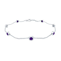 Real amethyst chain bracelet in bezel setting featuring polished purple gemstones on a delicate silver chain.