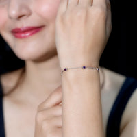 Real Amethyst chain bracelet in bezel setting by Rosec Jewels, featuring purple gemstones on a delicate silver chain.
