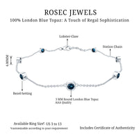 Bezel set London Blue Topaz station chain bracelet by Rosec Jewels, featuring vibrant blue gemstones on a delicate metal chain.