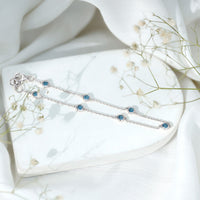 Bezel set London Blue Topaz station chain bracelet by Rosec Jewels, featuring elegant blue gemstones on a delicate silver chain.