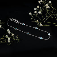 Bezel set London Blue Topaz station chain bracelet by Rosec Jewels featuring blue topaz gemstones on a silver chain