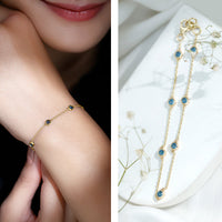Bezel set London Blue Topaz station chain bracelet by Rosec Jewels with oval blue topaz stones on a silver chain