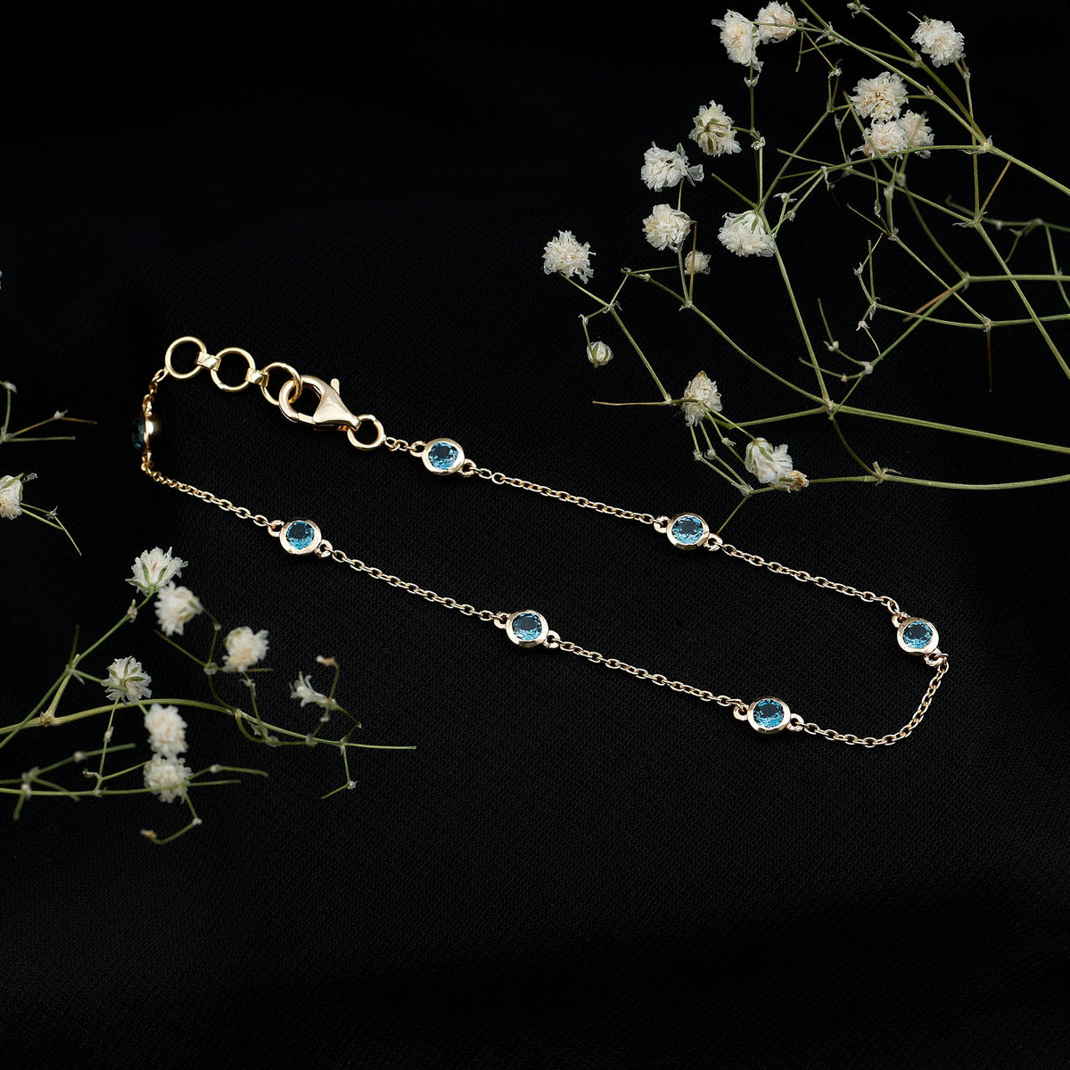London Blue Topaz station chain bracelet by Rosec Jewels featuring bezel-set blue topaz stones on a delicate silver chain.