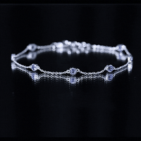 Certified natural Tanzanite chain bracelet for women featuring vibrant blue-violet gemstones and a delicate rose gold chain.