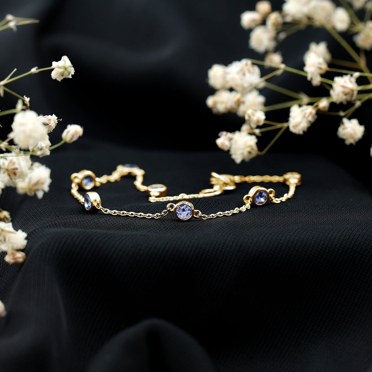 Certified natural tanzanite chain bracelet for women featuring vibrant blue tanzanite stones on a delicate silver chain.
