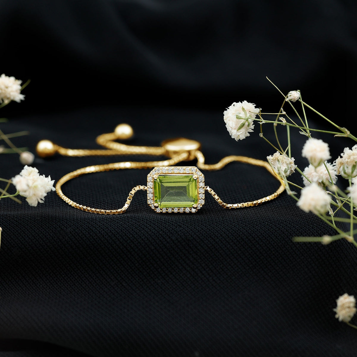 Emerald cut peridot and diamond bolo chain bracelet from Rosec Jewels with 1.8 carats of vibrant green peridot stones.